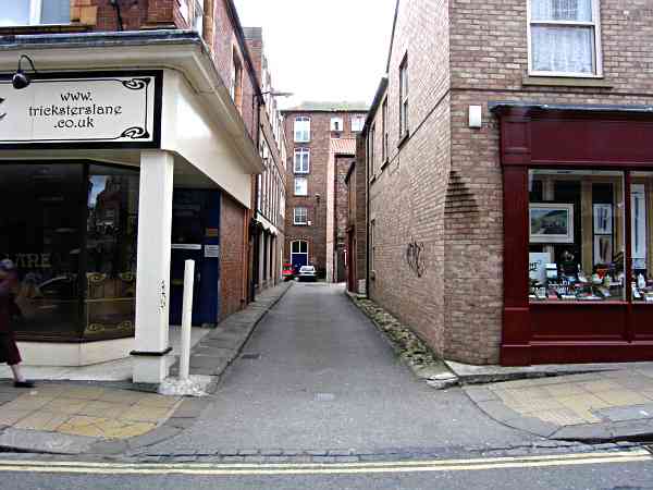 Lane leading to the yard and to Pavement.
