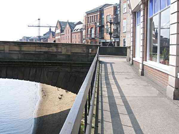 On the south bank of the river looking towards Ouse Bridge.